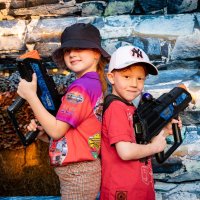 two kids play laser tag