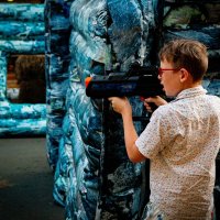 boy playing laser tag with a fun tagger