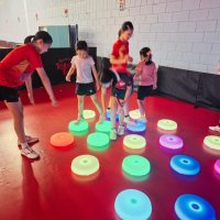 team of girls working together to make a shape